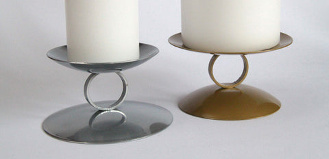 Reversible Pillar Candle Holder. Available in silver and gold. Made in UK.