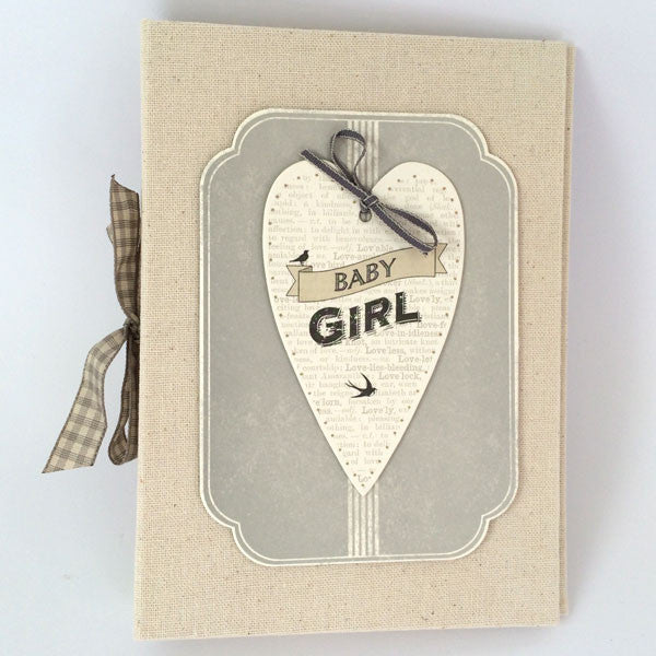 Pretty baby girl's photo album made of natural linen. The perfect gift or keepsake.